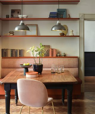 vintage dining table and orange upholstery with shelves