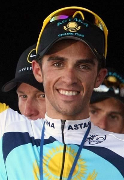 Alberto Contador smiles from the podium after his Astana team won the team time trial stage.