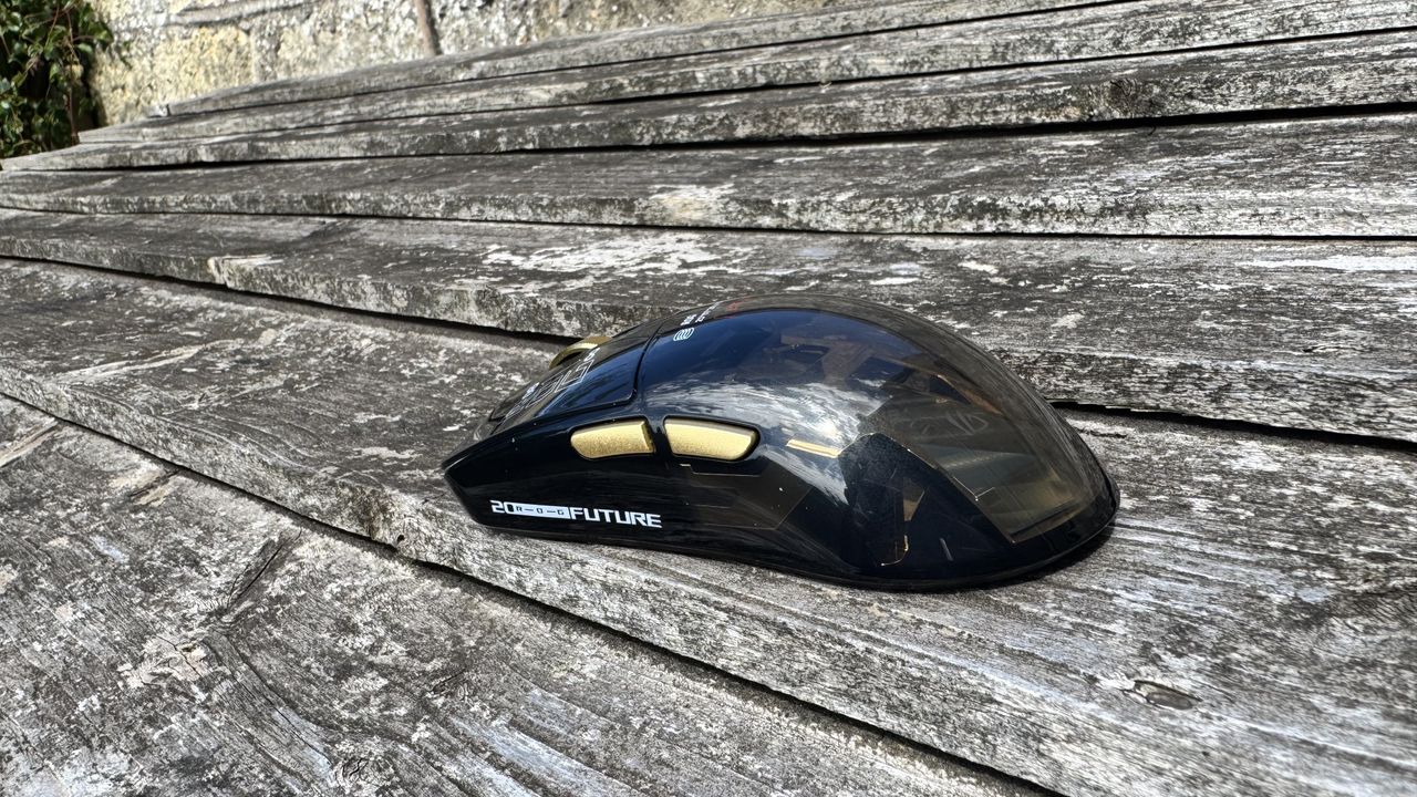 Asus ROG Harpe II Extreme Edition 20, on top of wood, from the back left