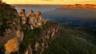 View over the landmark rock formation "Three sisters" in Blue Mountains, NSW, Australia on sunrise.