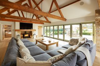 living room with sofa set and wooden flooring