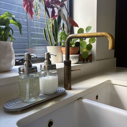 Stone sink caddy in kitchen