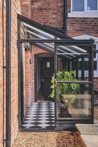 glass porch extension to brick house