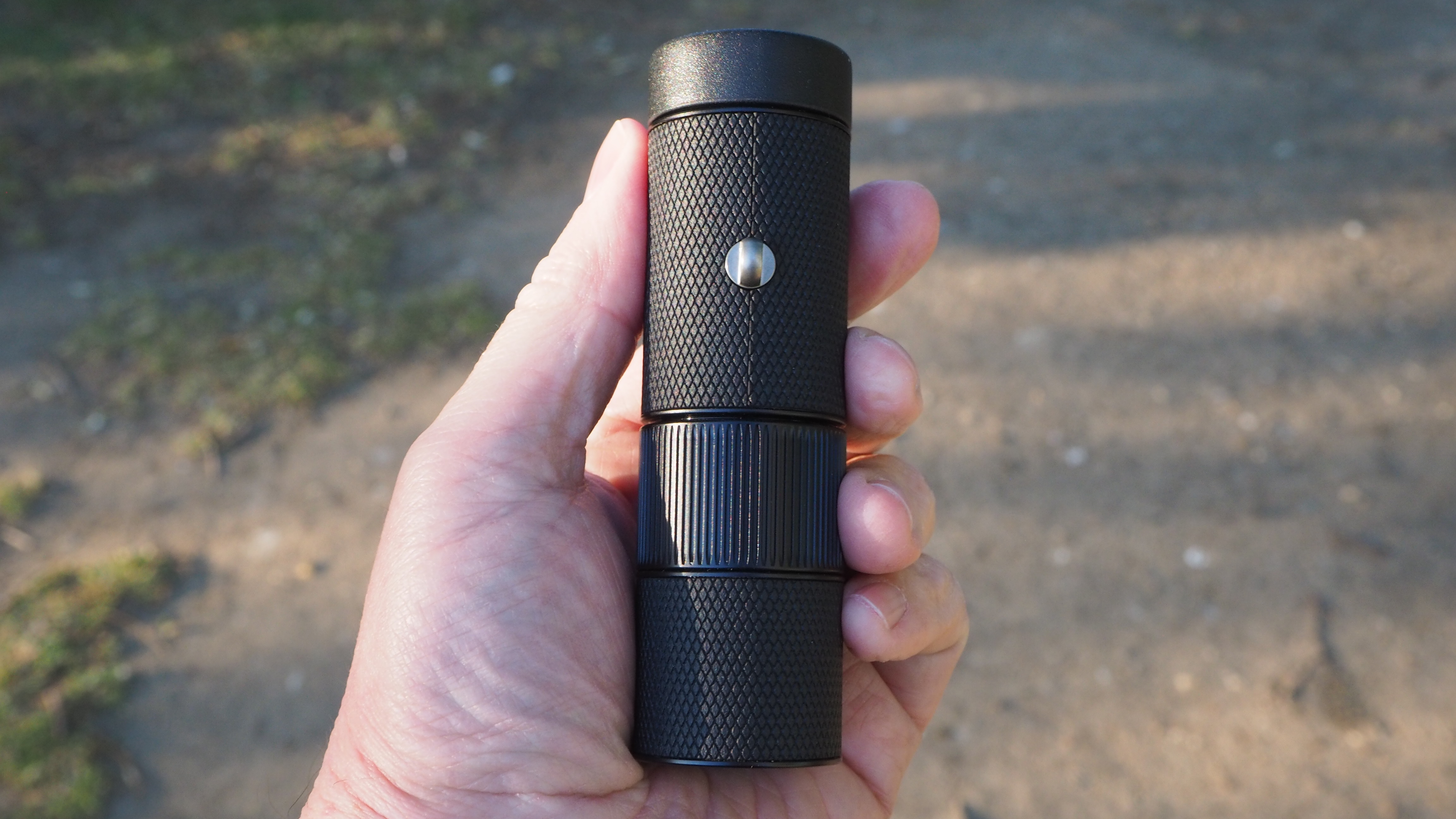 Leica Monovid 8x25 monocular held in someone's hand
