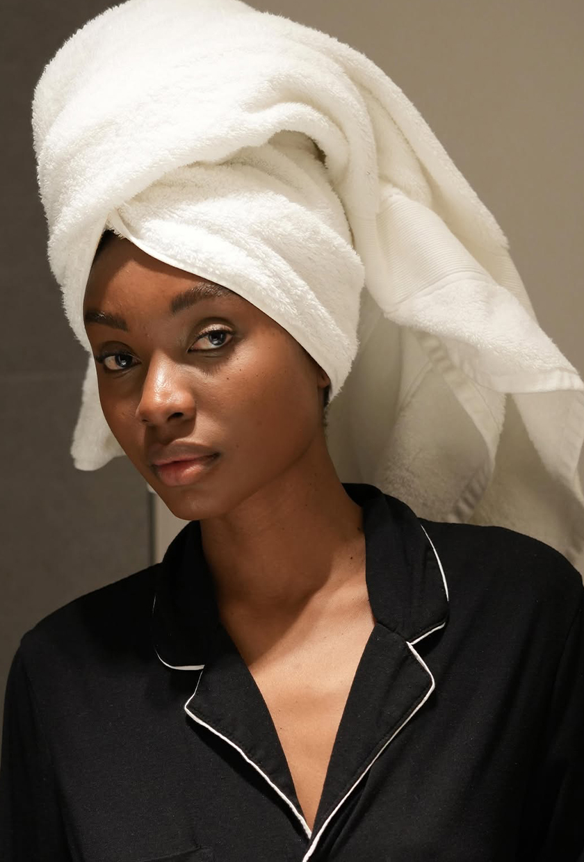 Natasha Ndlovu wearing a towel on head
