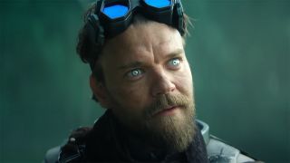 Pilou Asbaek's The Mule looking at something off-screen in Foundation season 3