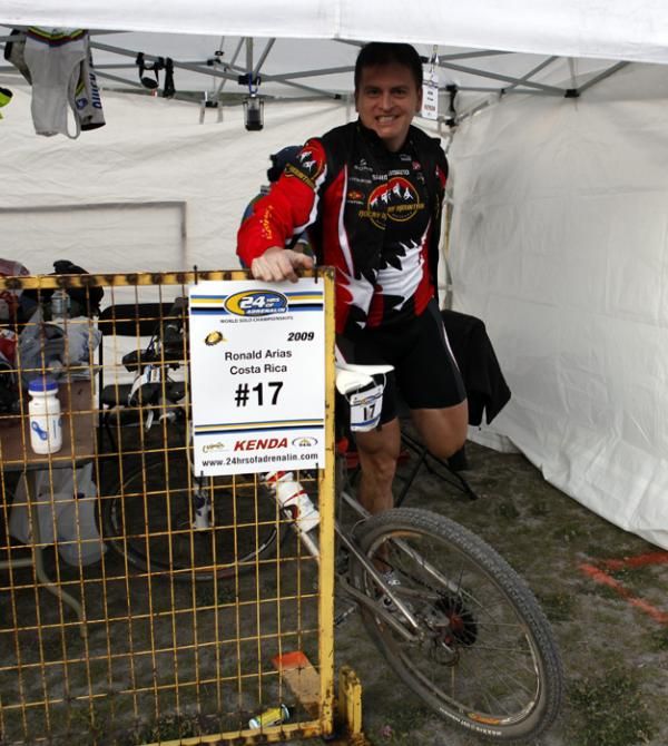 Costa Rica's Ronald Arias gets in a stretch in his pit area before the start.