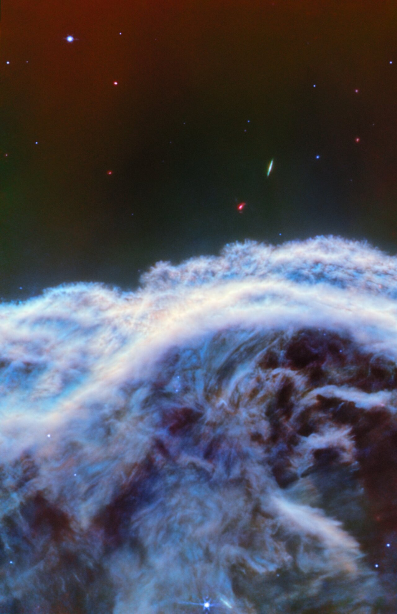 fuzzy wisps of blue and white gas in space
