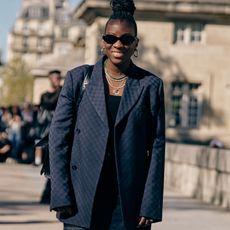 nikki ogunnaike wearing a blazer, a top, and shorts