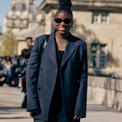 nikki ogunnaike wearing a blazer, a top, and shorts