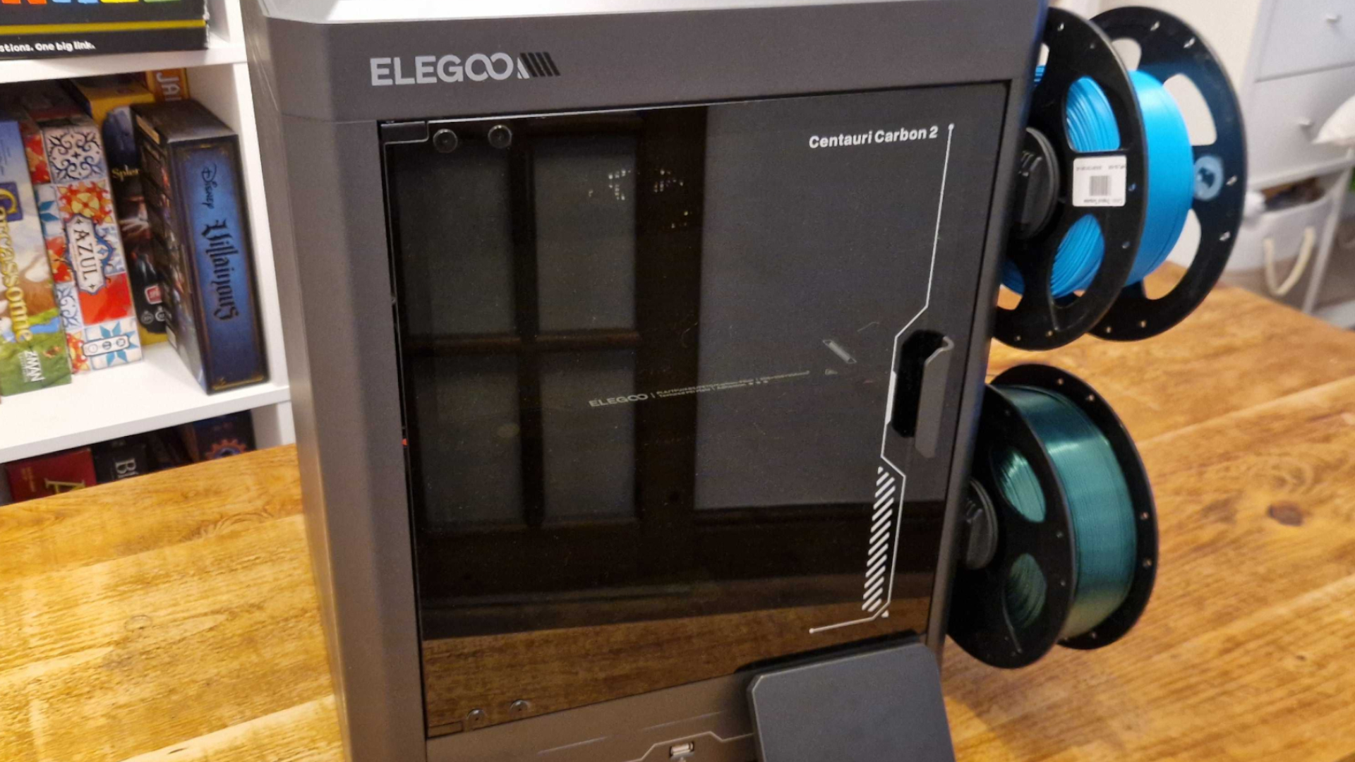 An Elegoo Centauri Carbon 2 Combo on a wooden table