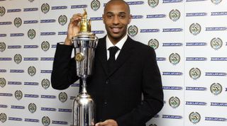 LONDON - APRIL 25: Thierry Henry of Arsenal poses with the PFA Players Player Of The Year Award at the PFA Awards Dinner at the Grosvenor House Hotel on April 25, 2004 in London. (Photo by John Stillwell-Pool/Getty Images)