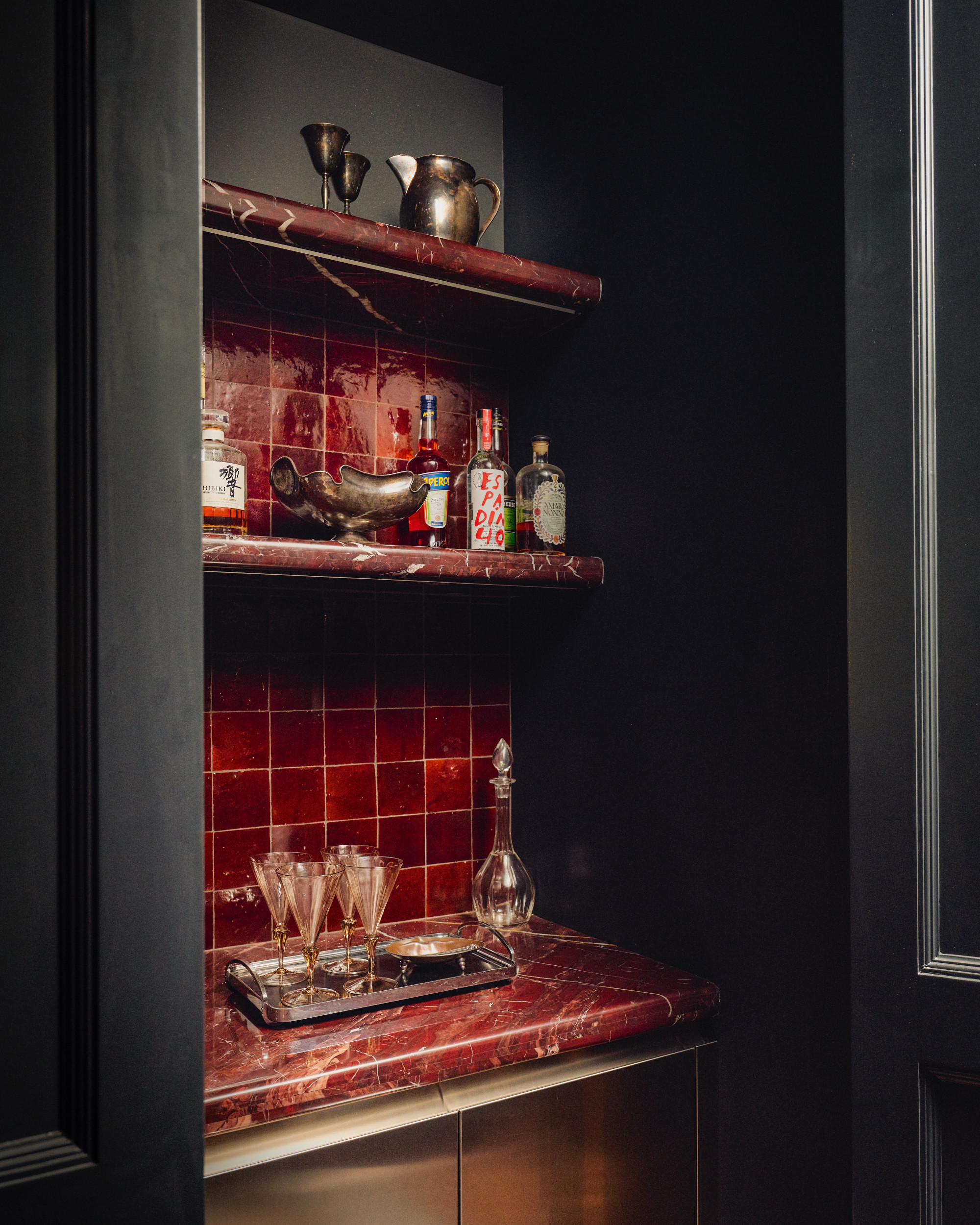 Bar area with red tiles and red marble countertop