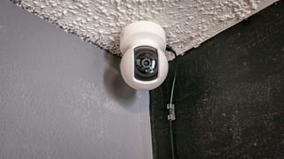 A TP-Link Kasa Spot Pan Tilt smart camera mounted on the ceiling