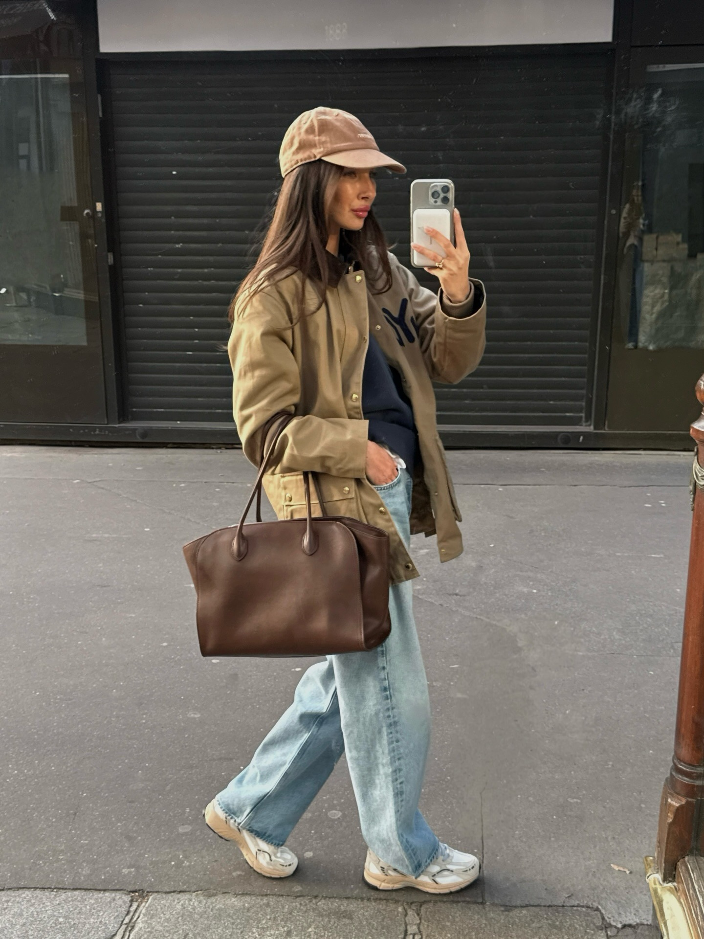 Woman wearing wide leg jeans with spring 2026 shoe trend.