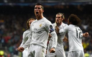 Cristiano Ronaldo celebrates with his Real Madrid team-mates after scoring his second goal against Wolfsburg in the Champions League in April 2016.