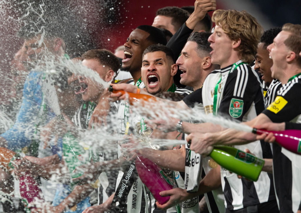 Newcastle United Head Coach Eddie Howe embraces Bruno Guimaraes of Newcastle United (39) following the Carabao Cup Final between Liverpool and Newcastle United at Wembley Stadium on March 16, 2025 in London, England. 