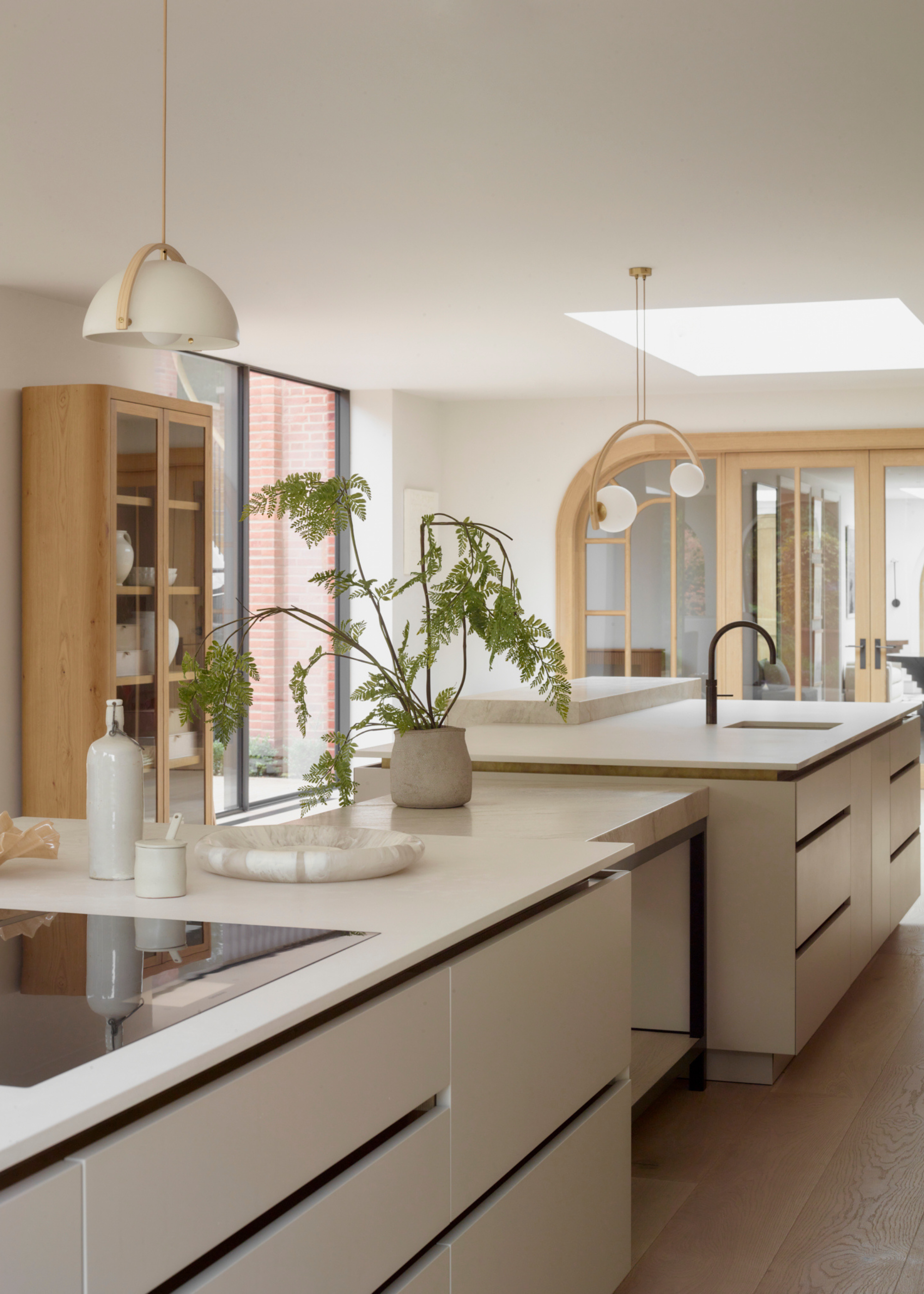 kitchen with various island zones and wooden details
