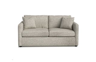 A small sofa bed with neutral beige upholstery