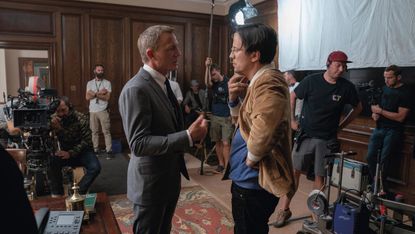 Daniel Craig talks to director Cary Joji Fukunaga on the set of James Bond: No Time to Die at Pinewood Studios (007.com)