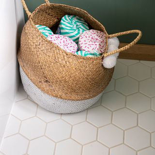 green bathroom with hexagonal floor tiles