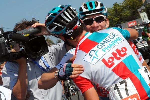 Andr&eacute; Greipel is congratulated by Omega Pharma-Lotto teammate Kenny De Haes after the German won the final stage.
