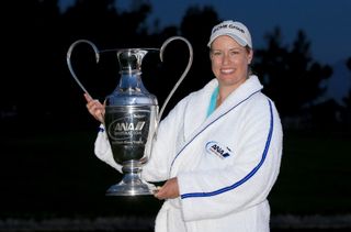 Brittany Lincicome holds the ANA Inspiration trophy