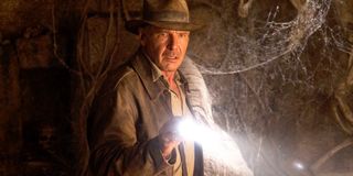 Indiana Jones (Harrison Ford) explores a cave in Indiana Jones and the Kingdom of the Crystal Skull (2008)