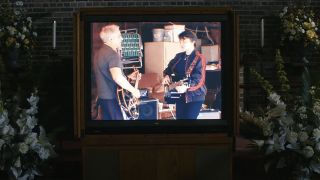 A TV shows Petey and June playing "Enter Sandman" on Severance