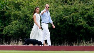 Catherine, Princess of Wales and Prince William, with their dog Orla, attend the Out-Sourcing Inc. Royal Charity Polo Cup at Guards Polo Club in 2022