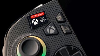 A Sandisk MicroSD card resting on top of the ROG Xbox Ally.