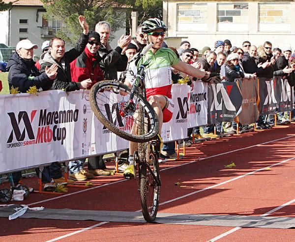 Marco Aurelio Fontana wheelies across the line upon winning.