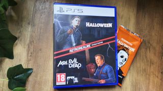 Image of the PS5 version of Halloween and Ash vs Evil Dead RetroRealms Double Feature on a wooden table.