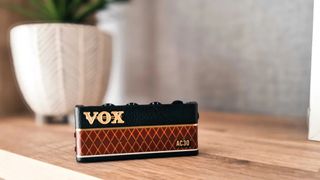 Vox amPlug on a shelve with plant in the background