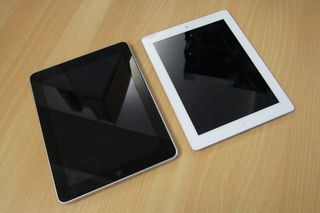 A white Apple iPad 2 side-by-side with its predecessor