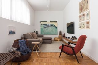 A rug placed on wooden flooring of a modern home