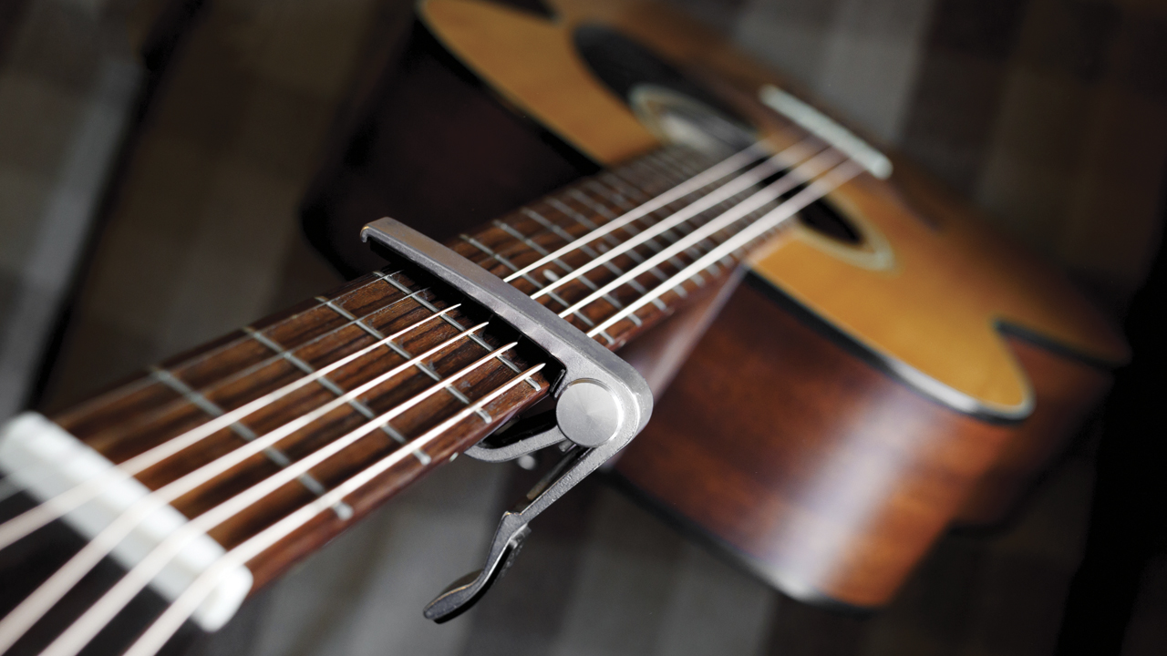 A guitar capo on an acoustic guitar