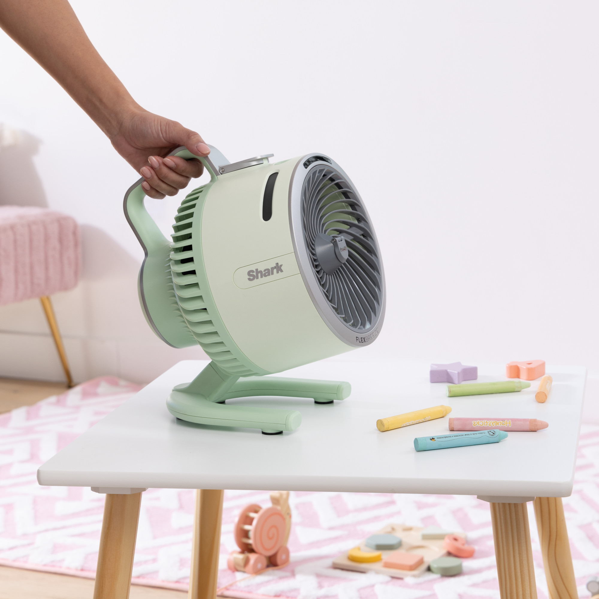 shark flexbreeze hydrogo fan in mint in a kids playroom