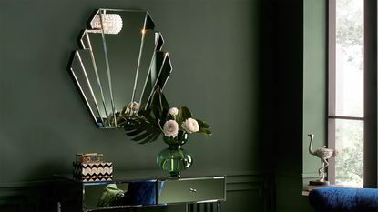 Shell shaped hallway mirror ideas by John Lewis with dark green wall paint decor and mirrored dresser