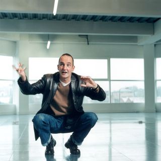 kevin mccloud with black blazer and blue jeans trouser