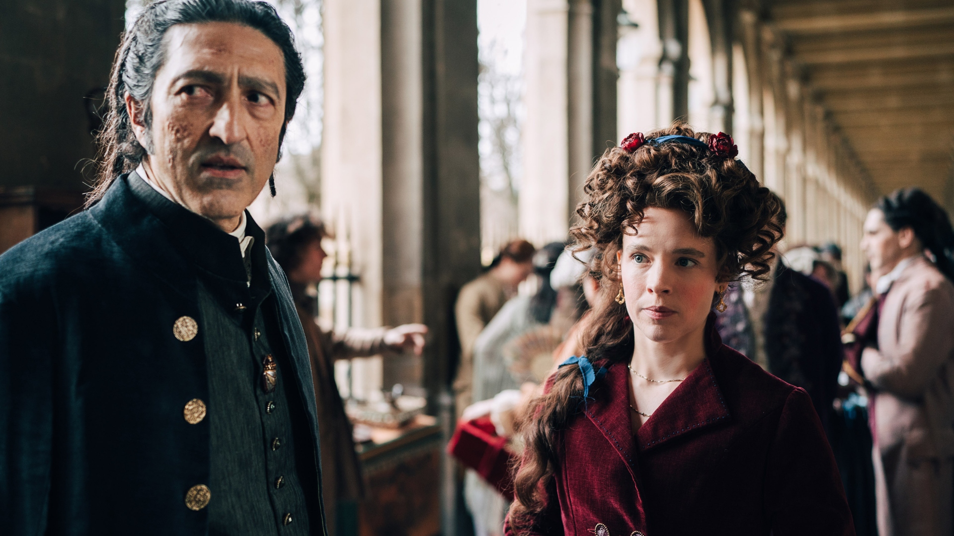 Felicite stands with Cogliostro in Marie Antoinette