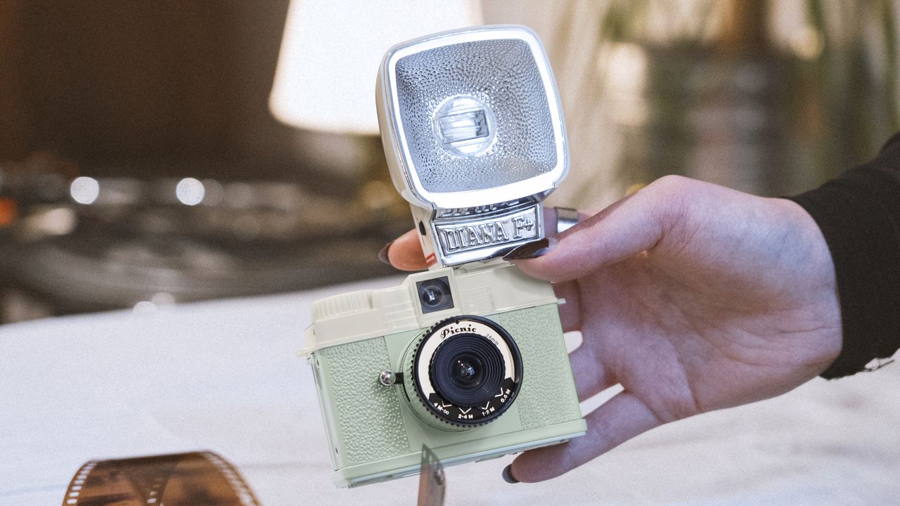 The Lomography Half-Frame Lomourette held in a person's hands