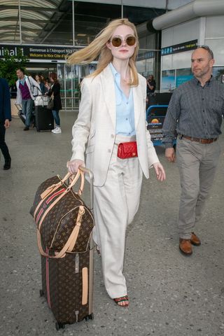 Elle Fanning carrying a Louis Vuitton bag