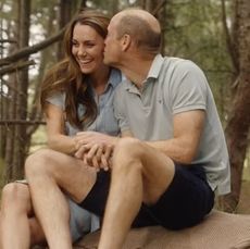 Kate Middleton and Prince William kissing in the woods