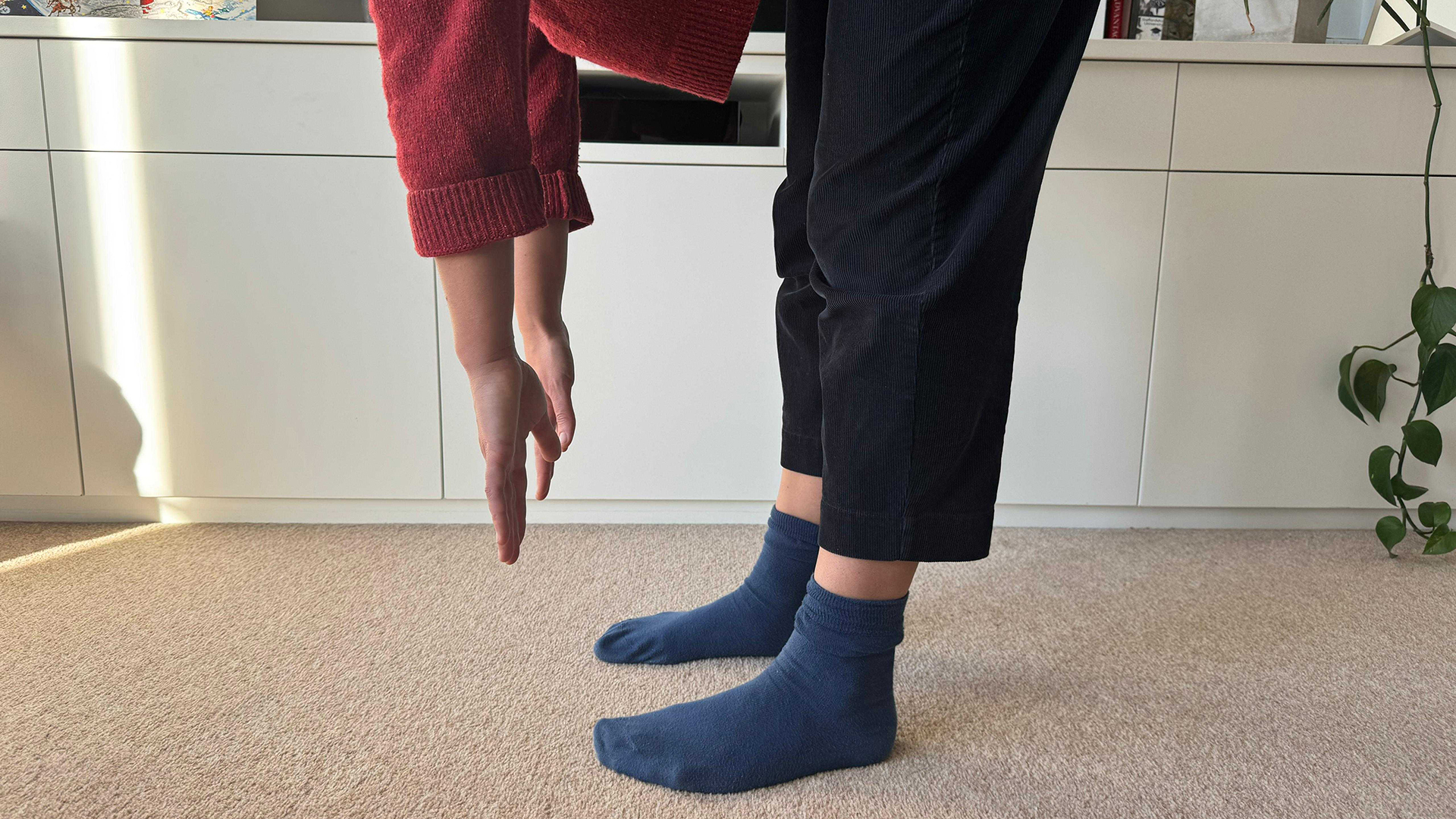 Article author stretching to try and touch her toes