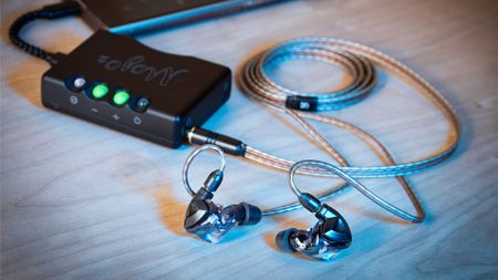 A photo of some wired IEMs, connected to a desktop DAC/Amp. 