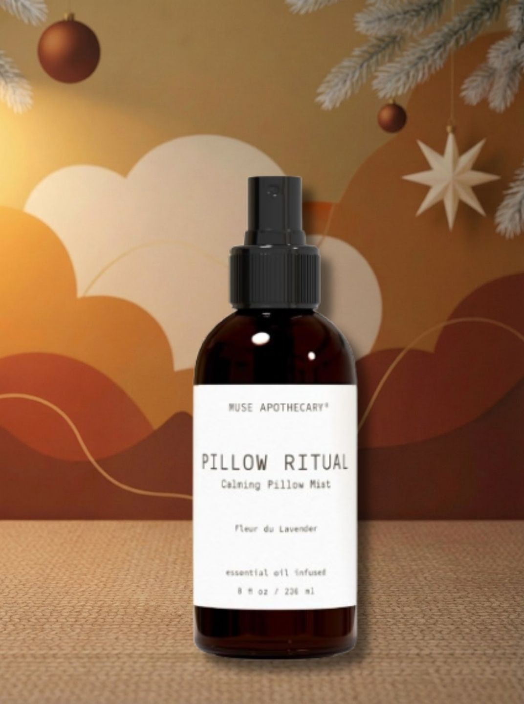 Bottle of Pillow Ritual spray by Muse on brown patterned Christmas background