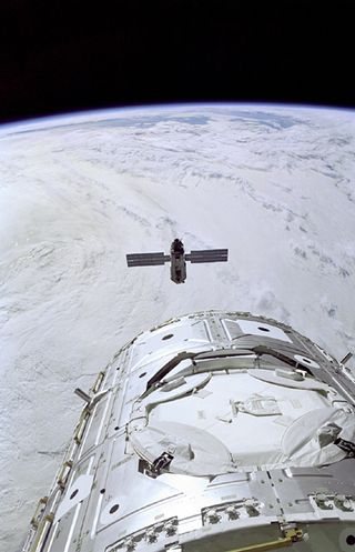 The Space Shuttle Endeavour prepares to rendezvous with the FGB.