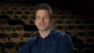 Zack Snyder, dressed in denim button up, sits for an interview discussing the making of his 4 hour vision of the Justice League. 