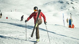 A skier tries a ballet move